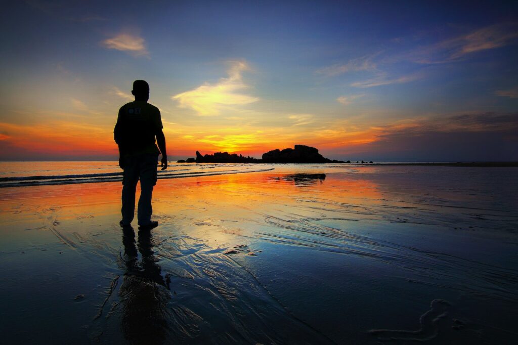 Storm of stress: Silhouette of Man Standing on Seashore