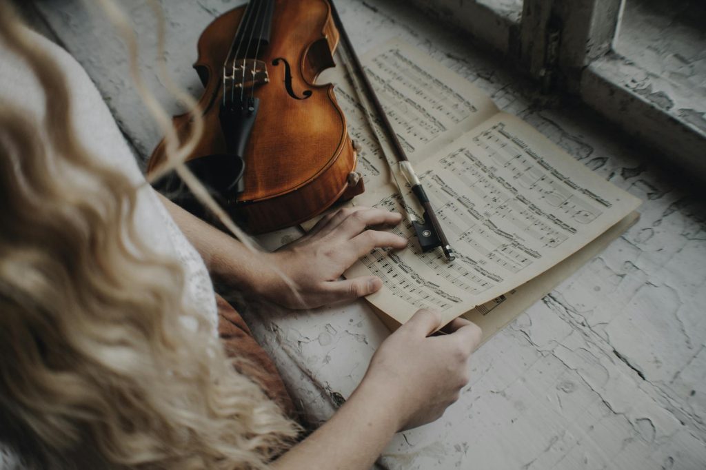 Close up on notebook with tones on windowsill.
Musical Instruments and Spirituality